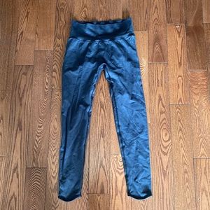 Gymshark grey leggings with detailing on back and gymshark logo near ankle